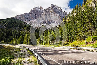 View to road and Dolomites mountains, Italy, Europe Stock Photo