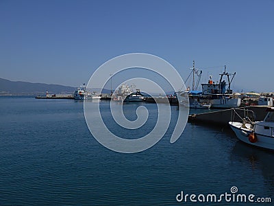 View to sea dock with little fishing boats floating Editorial Stock Photo