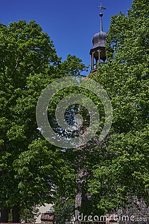 View to the tower of a medieval village church in the state of Brandenburg, Germany Stock Photo