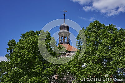 View to the tower of a medieval village church in the state of Brandenburg, Germany Stock Photo
