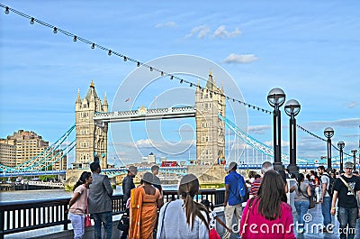 View to the Towerbridge in London with tourists in the foreground Editorial Stock Photo