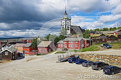 View to the traditional wooden houses and church bell tower of the copper mines town of Roros in Roros, Norway. Editorial Stock Photo