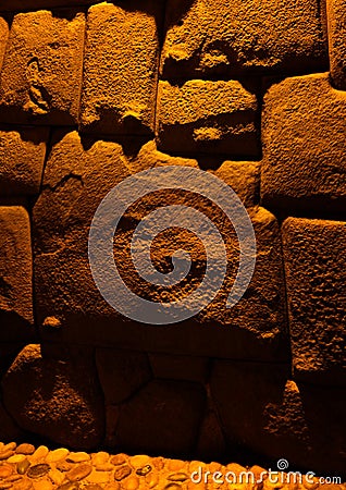 View to Twelve-angled stone aka Hatun Rumiyoc as a part of a wall of the palace of the Archbishop of Cuzco, Peru Stock Photo