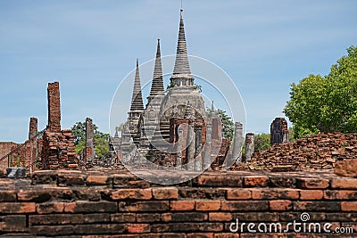 View to Wat Phra Si Sanphet temple in Ayutthaya historical park and temple bricks wall ruins remains, Ayutthaya, Thailand Stock Photo
