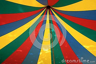 View into the top of a colorful striped circus tent, festival event concept Stock Photo