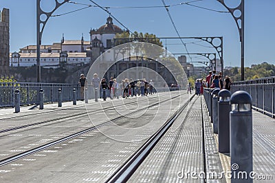 View of the top of D. Maria bridge and people walking in the Porto city Editorial Stock Photo