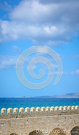 View of the top of the fortress wall in Crete, the sea and the island in the distance Stock Photo