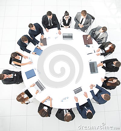 View from the top.meeting of shareholders of the company at the round - table. Stock Photo