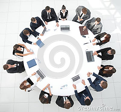 View from the top.meeting of shareholders of the company at the round - table. Stock Photo