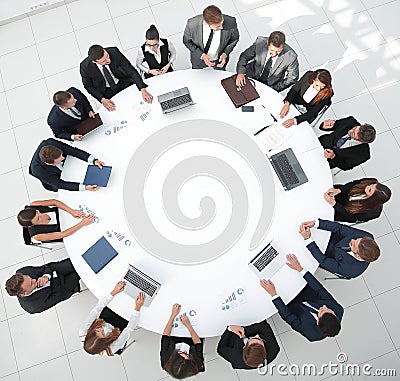 View from the top.meeting of shareholders of the company at the round - table. Stock Photo