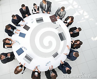 View from the top.meeting of shareholders of the company at the round - table. Stock Photo