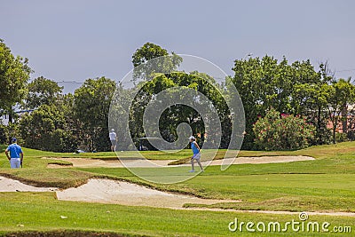 View of tourists playing golf on sunny summer day. Editorial Stock Photo