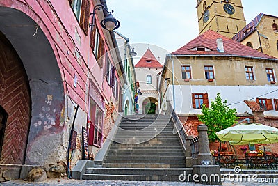 View towards the Stairs Tower Turnul Scarilor, a popular tourist attraction in Sibiu, Romania, at the edge of pedestrian area. Editorial Stock Photo