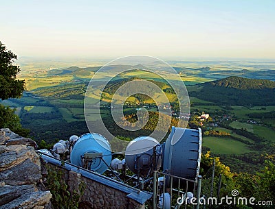 View from tower of meteorological observatory with many parabolic satellites to morning countryside. Spring morning Stock Photo