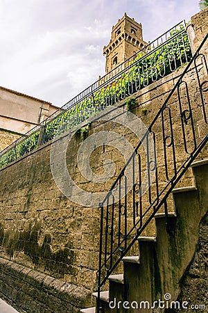 View on the tower in Pitigliano over the tuf wall and stairs Stock Photo