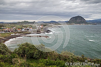 View of a town and coastline on Jeju Island Stock Photo