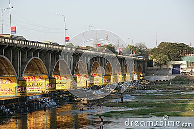 View of town from the river dried up and the bridge, South India, Kerala, Madurai Editorial Stock Photo