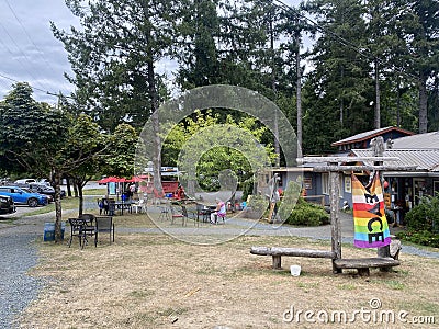 A view of the town square on Denman Island with a cafe and arts and craft store Editorial Stock Photo