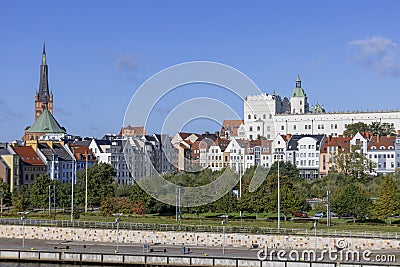 View of townhouses on Piastowski Boulevard, in the background a tower of Szczecin Cathedral, Szczecin, Poland Editorial Stock Photo