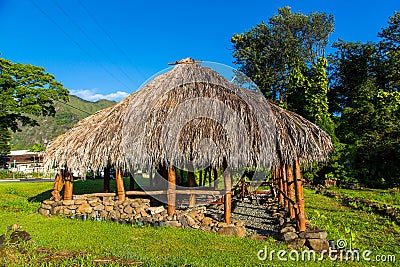 View of a traditional Hawaiian house standing in the park near Honolulu on a blue sky background Stock Photo