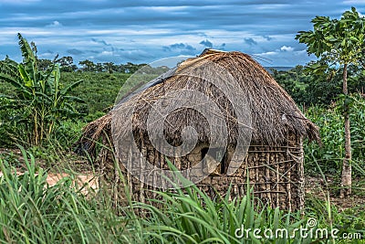 View of traditional village, house thatched with roof and terracotta and straw walls Stock Photo