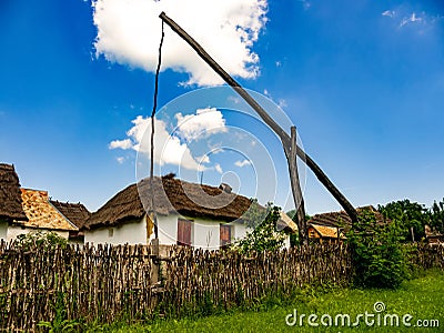 View on a traditional well and hungarian pise houses in Szentendre Editorial Stock Photo