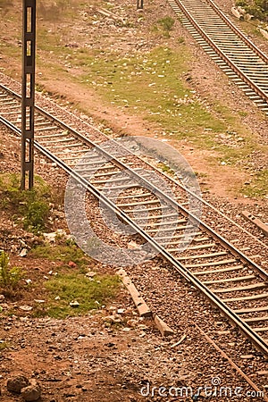 View of train Railway Tracks from the middle during daytime at Kathgodam railway station in India, Train railway track view, Stock Photo