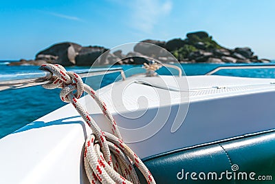 View of tropical sea from yacht or boat, anchor rope tied, clear water and stone beautiful like a heaven Stock Photo