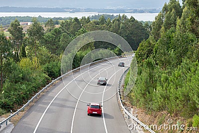 View of the turn of the highway between the mountains Stock Photo