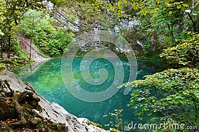 View of turquoise colored Divje jezero or Wild lake near Idrija Stock Photo