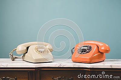 View of two old telephones on a table. Stock Photo