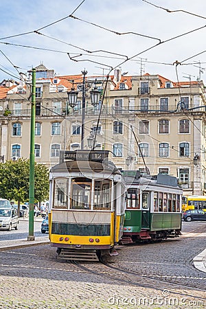 View of two old trams in touristic downtown lisbon, Portugal Editorial Stock Photo