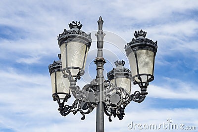 View of a typical Andalusian streetlight with four lights Stock Photo