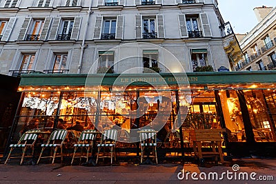 View of typical Parisian cafe Le Corner St . Germain . It is located on famous Saint Germain boulevard in Paris, France. Editorial Stock Photo