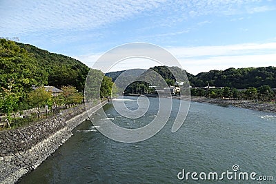 View of Uji river in the neighborhood of historical Byodo-in temple in Uji city, near Kyoto, Japan Stock Photo