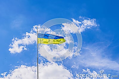 The view on the Ukrainian flag flying over the hill in the Trypillya village Stock Photo