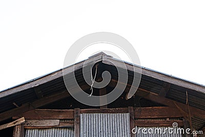 View under Galvanized roof old of home structure large made with plate galvanized sheet attached on of wooden house. Stock Photo