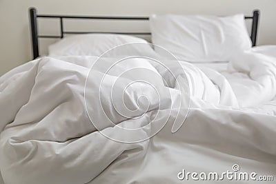 View of an unmade bed Stock Photo