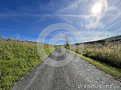 View up, Back Lane with hazy sunshine in, Newton, Clitheroe, UK Stock Photo