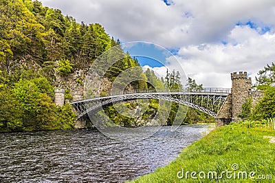 A view up the River Spey towards the castellated tower bridge at Craigellachie, Scotland Stock Photo