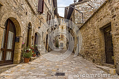 A view up a street leading up Mount Subasio in Assisi, Umbria Stock Photo
