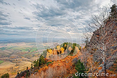 View of the valley of the autumn foothills from the ascent to Mount Babyrgan in the Altai mountains Stock Photo