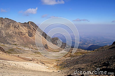 View of valley and smog from volcan Popocatepetl eruption from volcan Iztaccihuatl Stock Photo