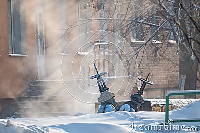 View of valves, cranes on the pipes of the heating main Stock Photo