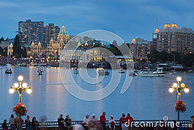 View of Victoria city Inner harbor with crowds waiting for fireworks display. Editorial Stock Photo