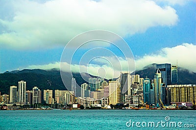 View of Victoria`s harbor from Tsim Sha Tsui TST waterfront, Hong Kong, China Stock Photo