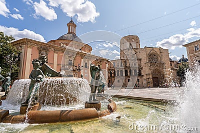 View of the Virgin Square with Valencia Cathedral and Turia Fountain under the clear, blue sky Editorial Stock Photo