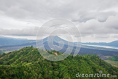 View of the volcano Batur and the jungle Stock Photo