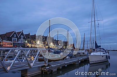 View of the Volendam harbor and yacht, boats and sailing boats anchored Stock Photo