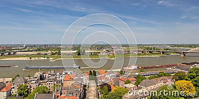 View at the Dutch Waal river with cargo riverboats Stock Photo